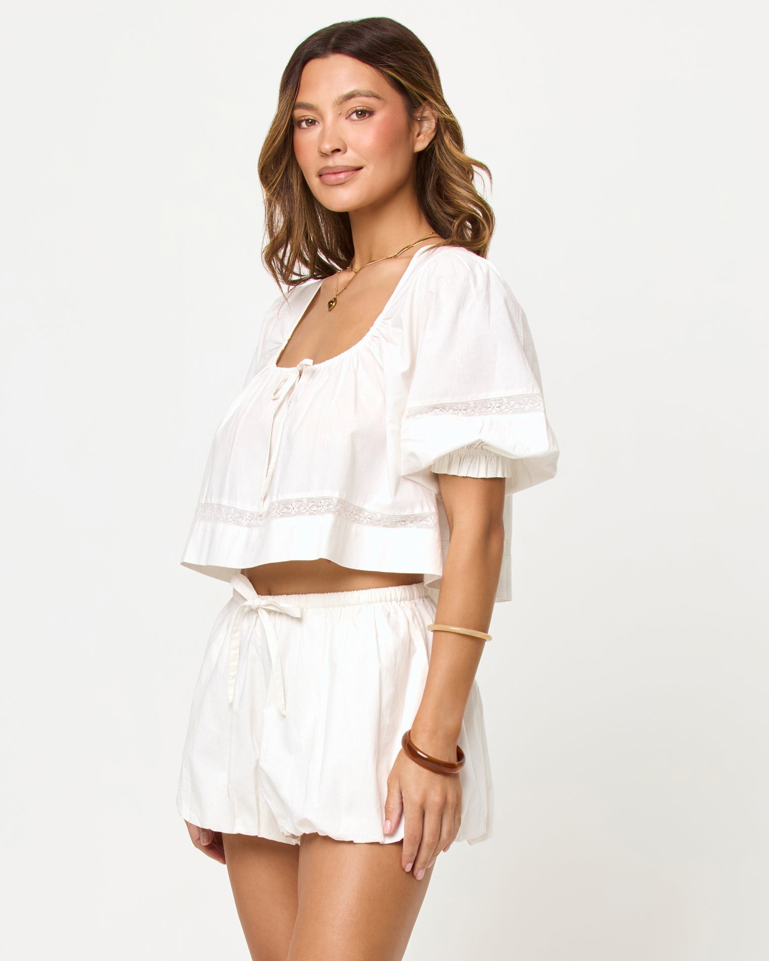 LSPACE Lucie Short in cream, three-quarter view on model.