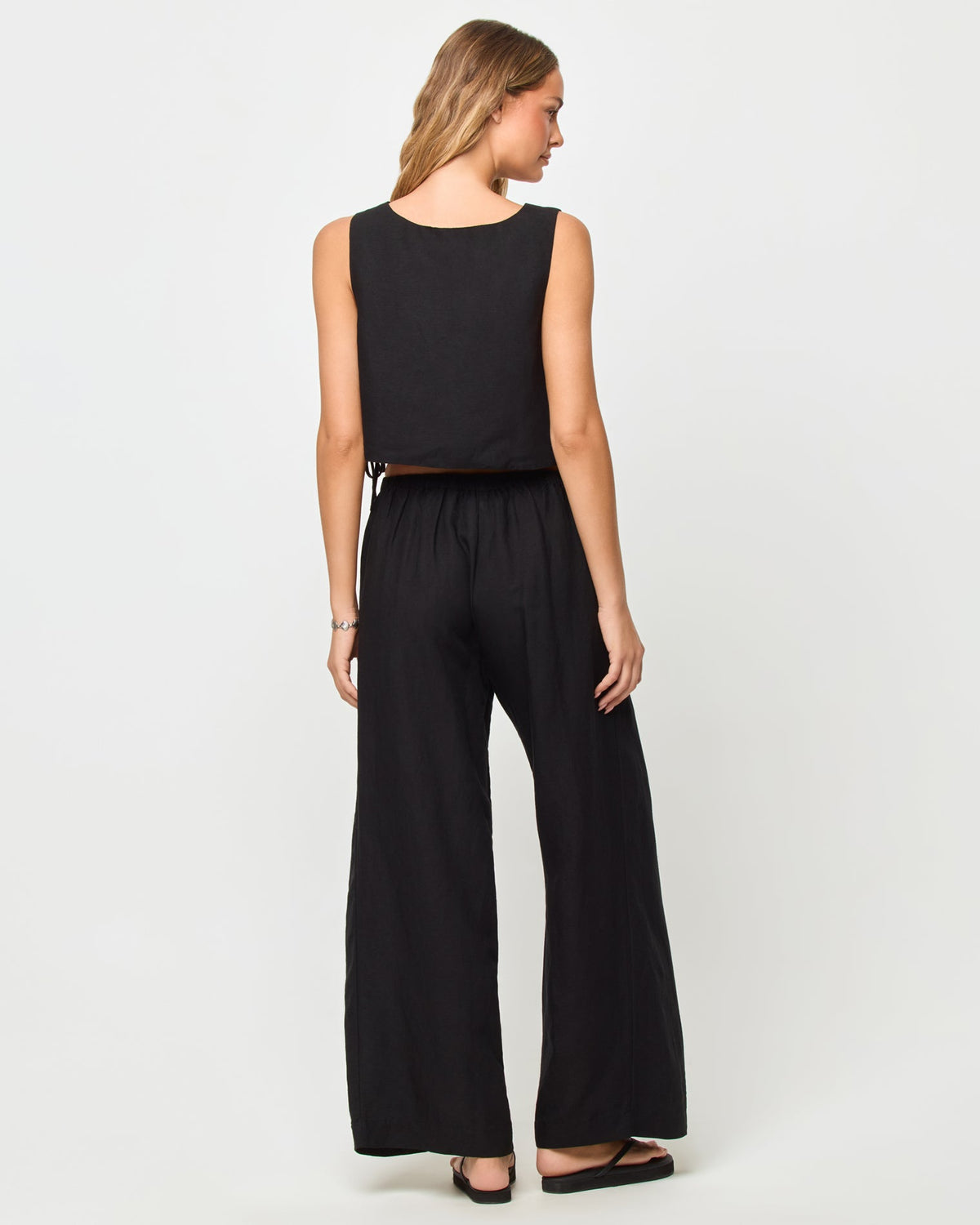 LSPACE Rylee pant in black, back view on model.