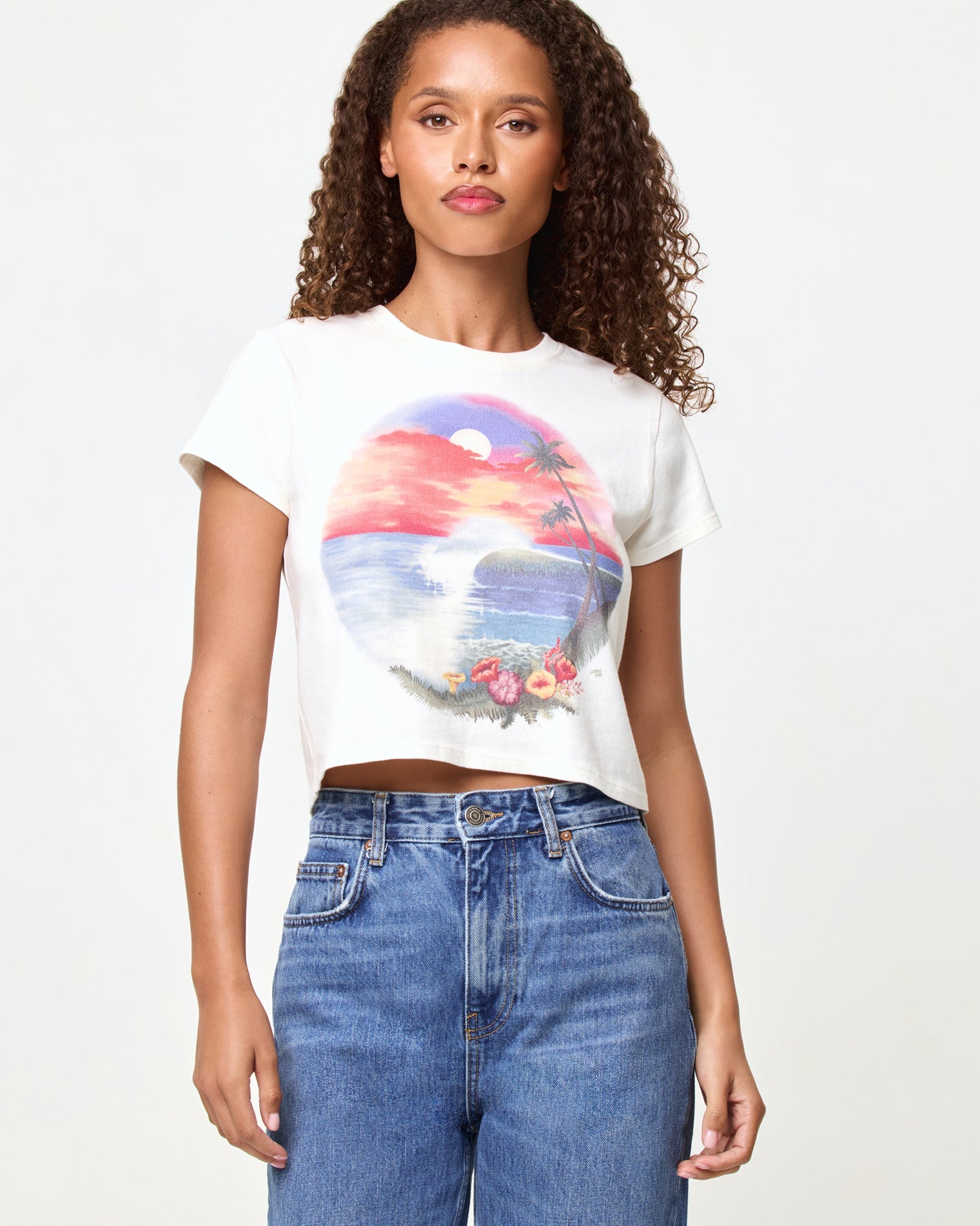 LSPACE Merci Baby Tee in airbrush tourist tee graphic, close-up front view on model styled with jeans.