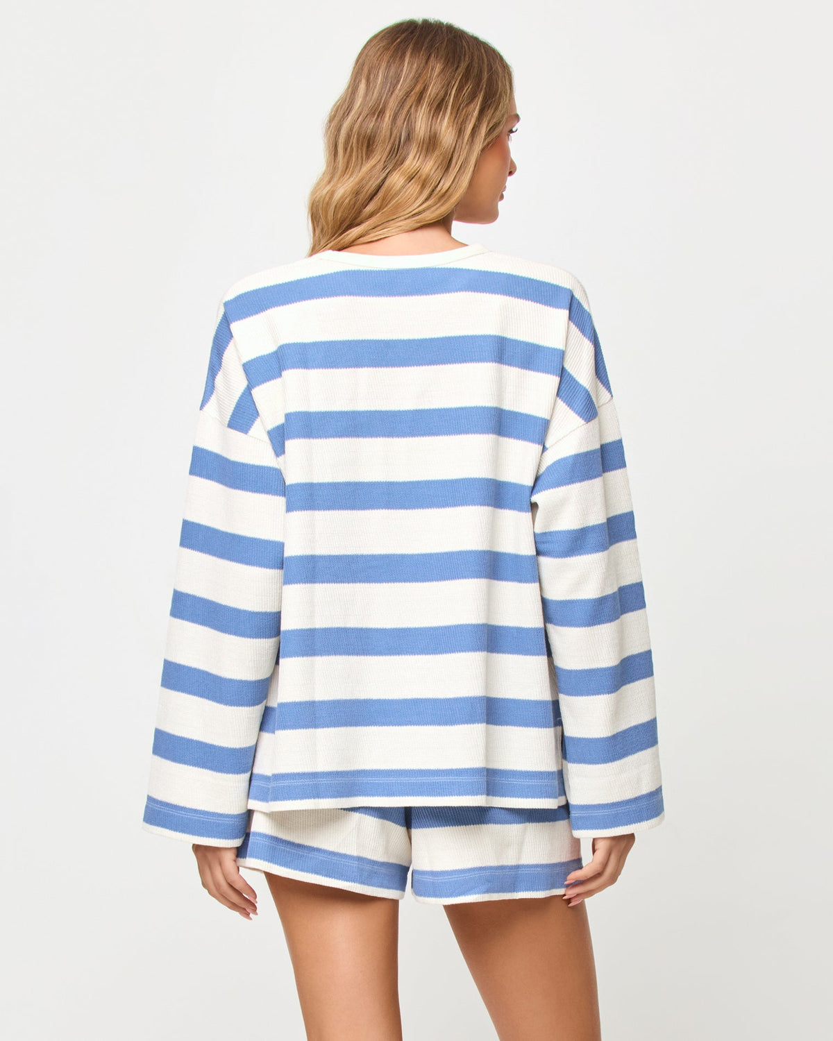 LSPACE Maeve short in Chambray-Cream Stripe print, back view on model.