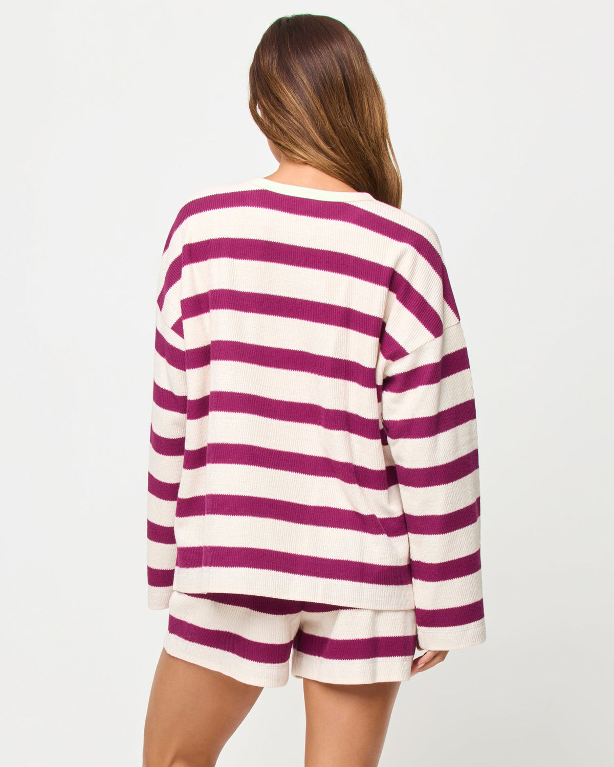 LSPACE Maeve top in Berry Jam Cream print, back view on model.