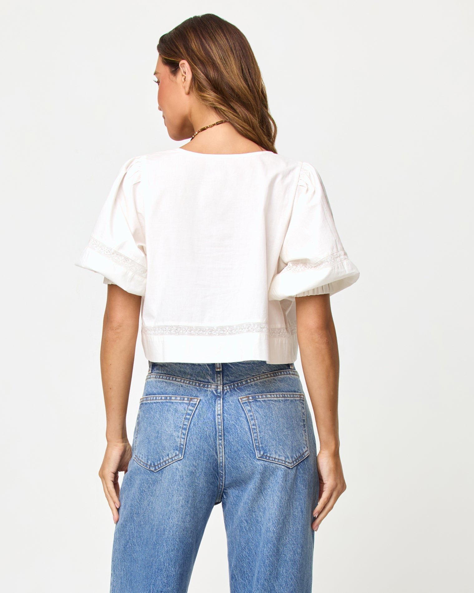 LSPACE Lucie top in Cream, back view on model.
