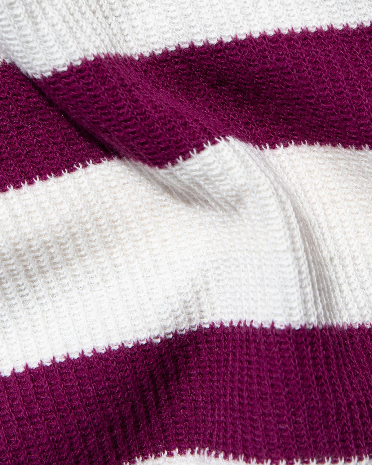 Closeup image of the Maeve Top in Berry Jam Cream, showing the waffle knit texture.