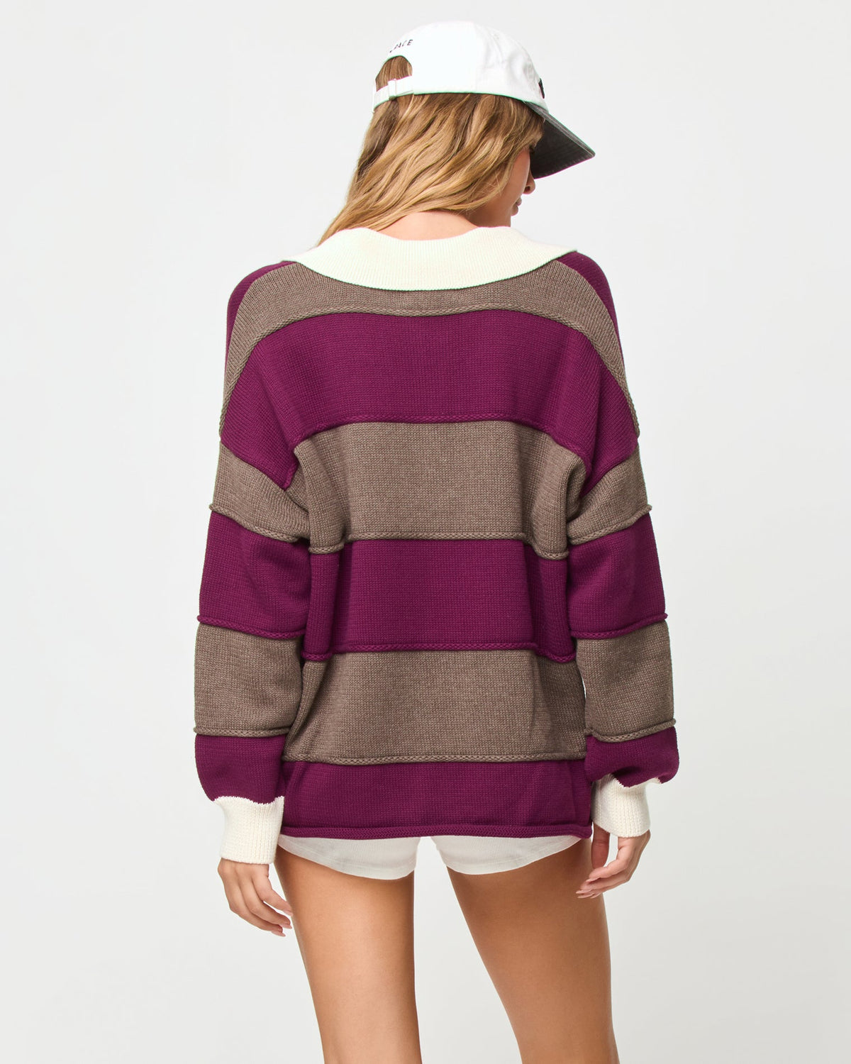 LSPACE Horizon sweater in I'm Berry Busy stripe, back view on model.