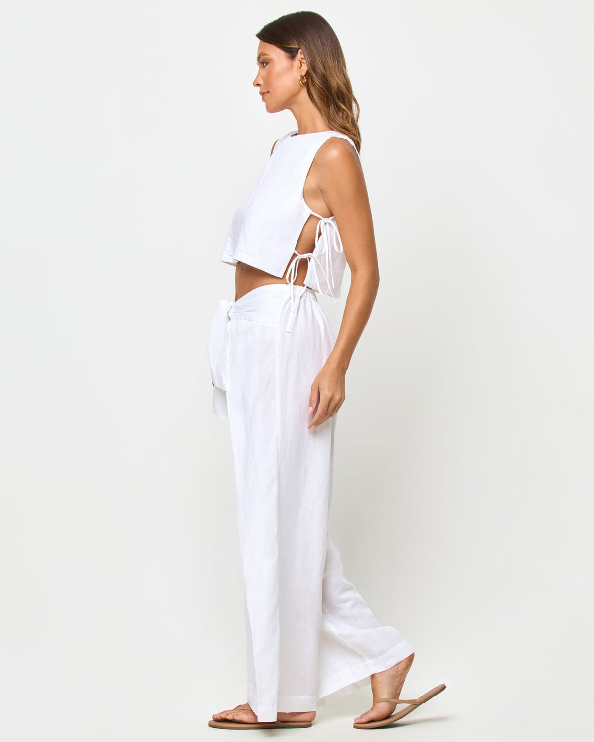 LSPACE Rylee pant in white, side view on model.