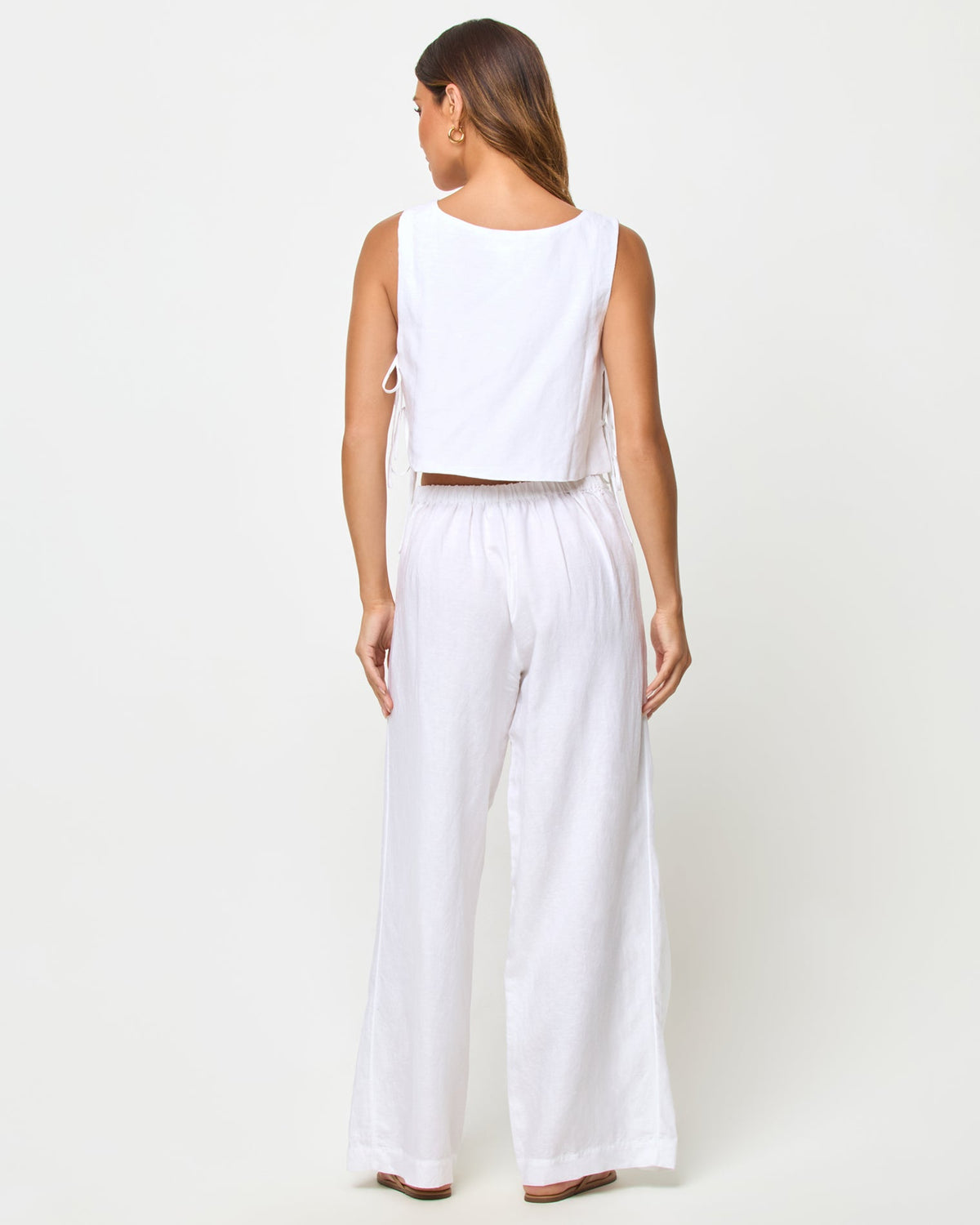 LSPACE Rylee pant in white, back view on model.