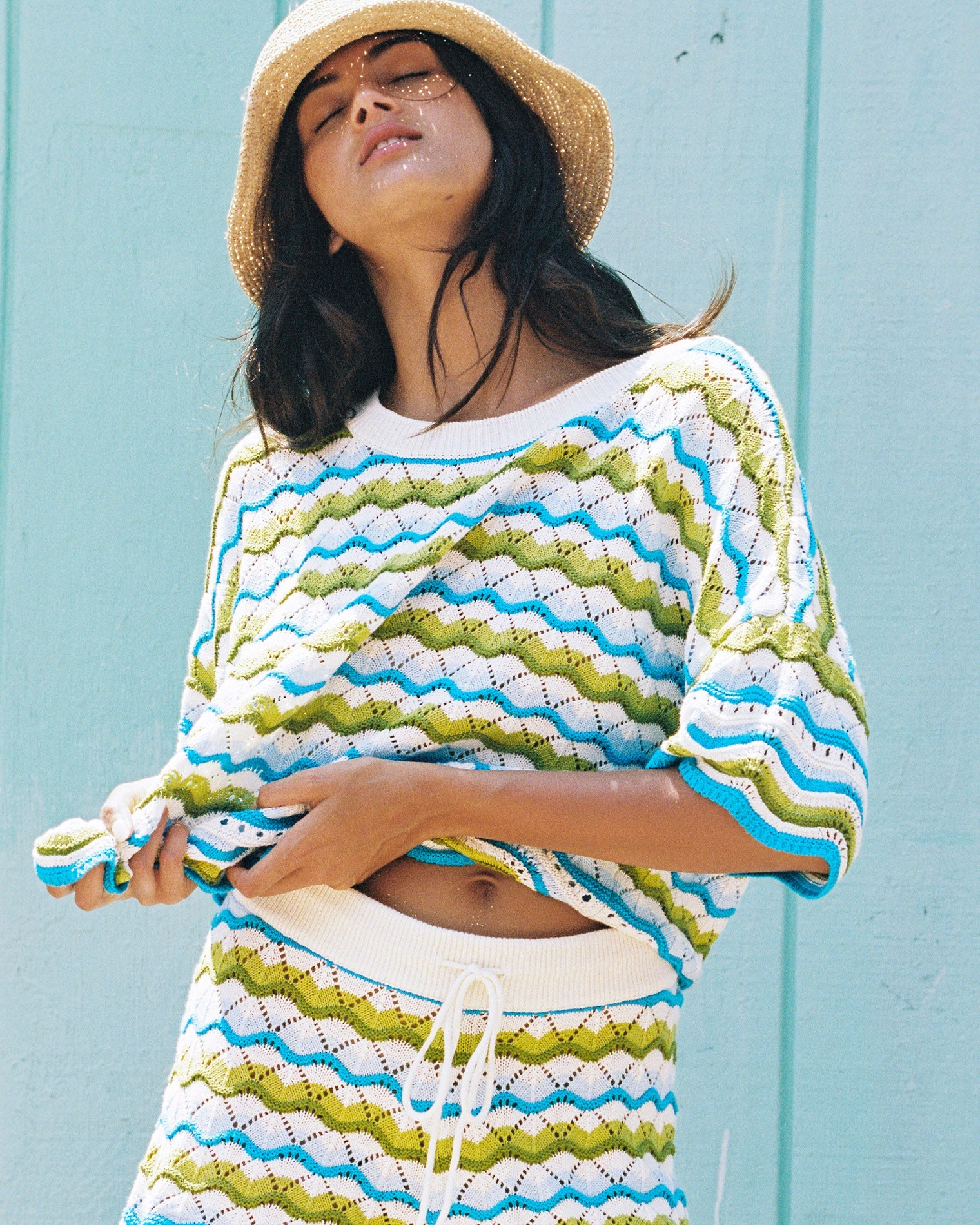 Island Breeze | Badge:New Arrival_#B2AC88_#ffffff'
LSPACE Sunchaser top in Island Breeze, lifestyle editorial view on model.