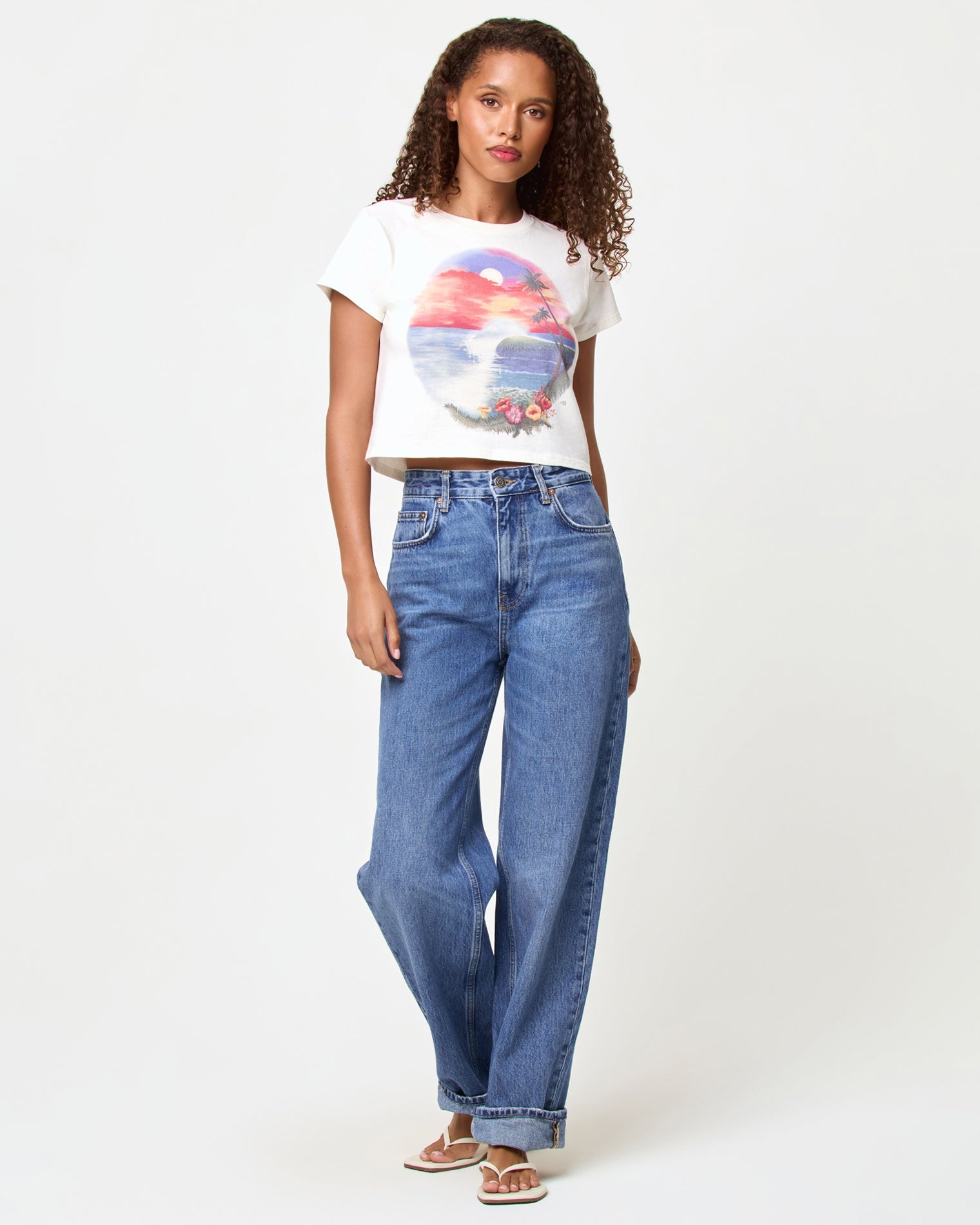LSPACE Merci Baby Tee in airbrush tourist tee graphic, front view on model styled with jeans.