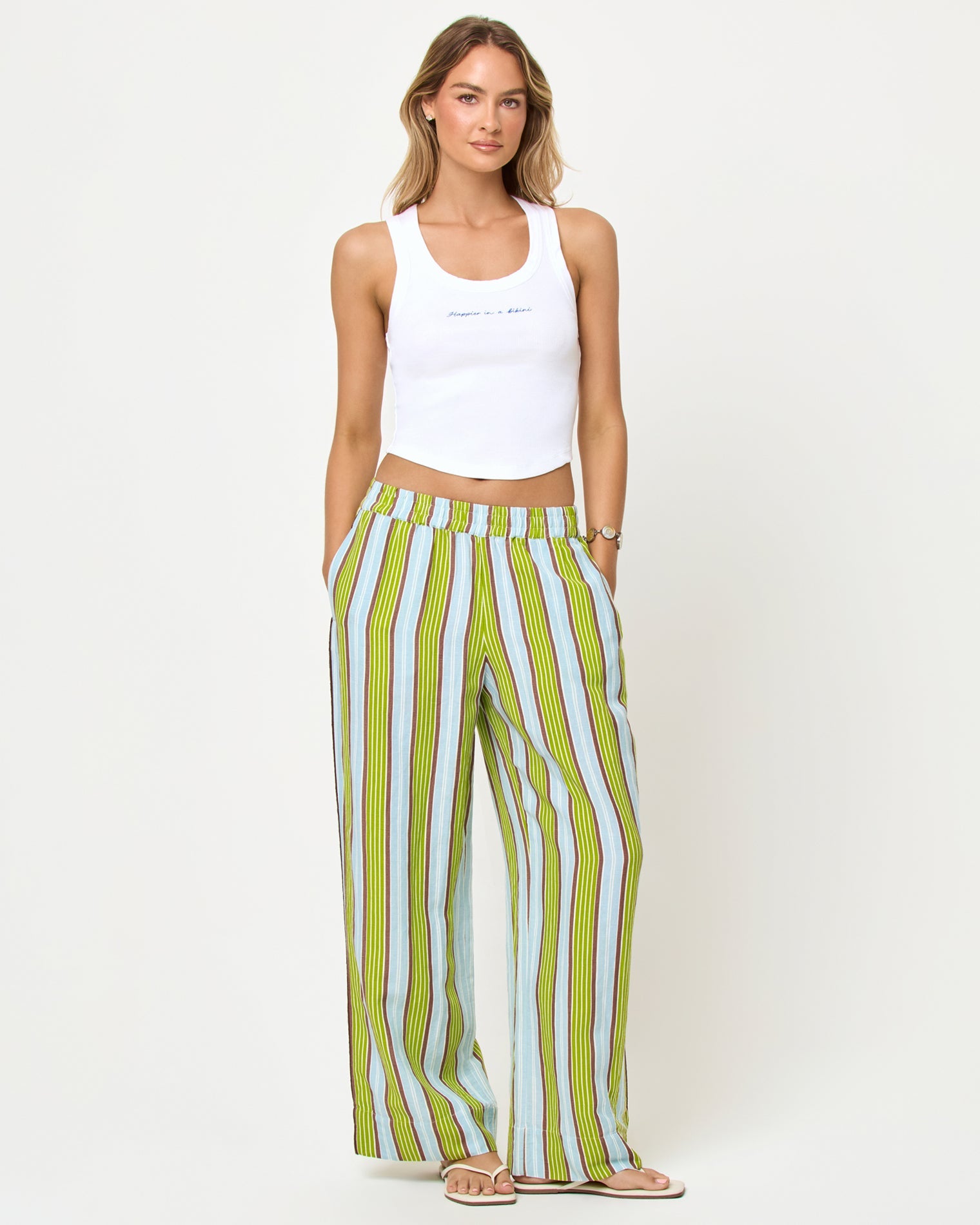 LSPACE Sur Pant in Comporta Cool Girl print, front view on model with white crop tank.