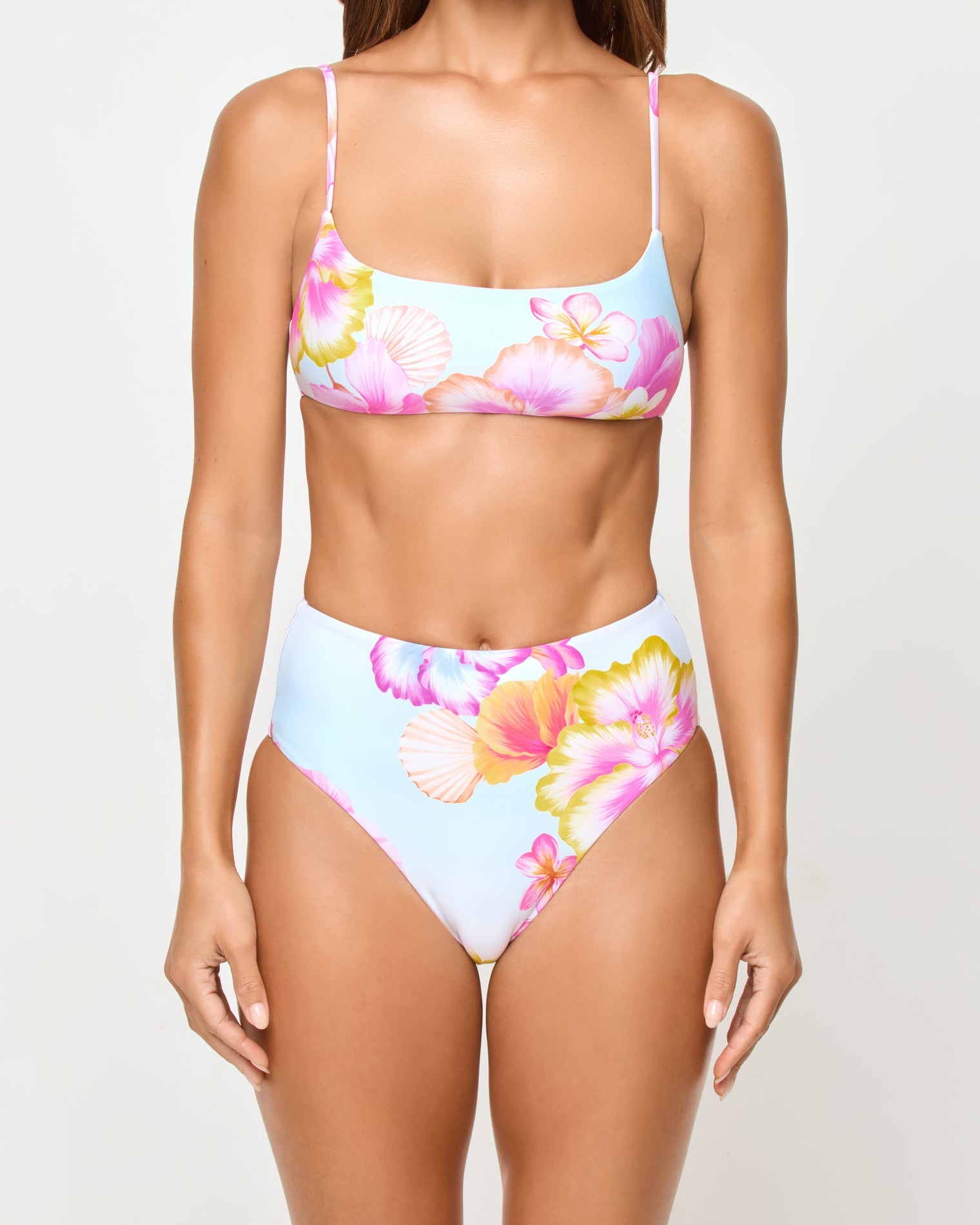 LSPACE Presley bikini top in Hibiscus And Plumeria Oh My print, close-up detail view on model.