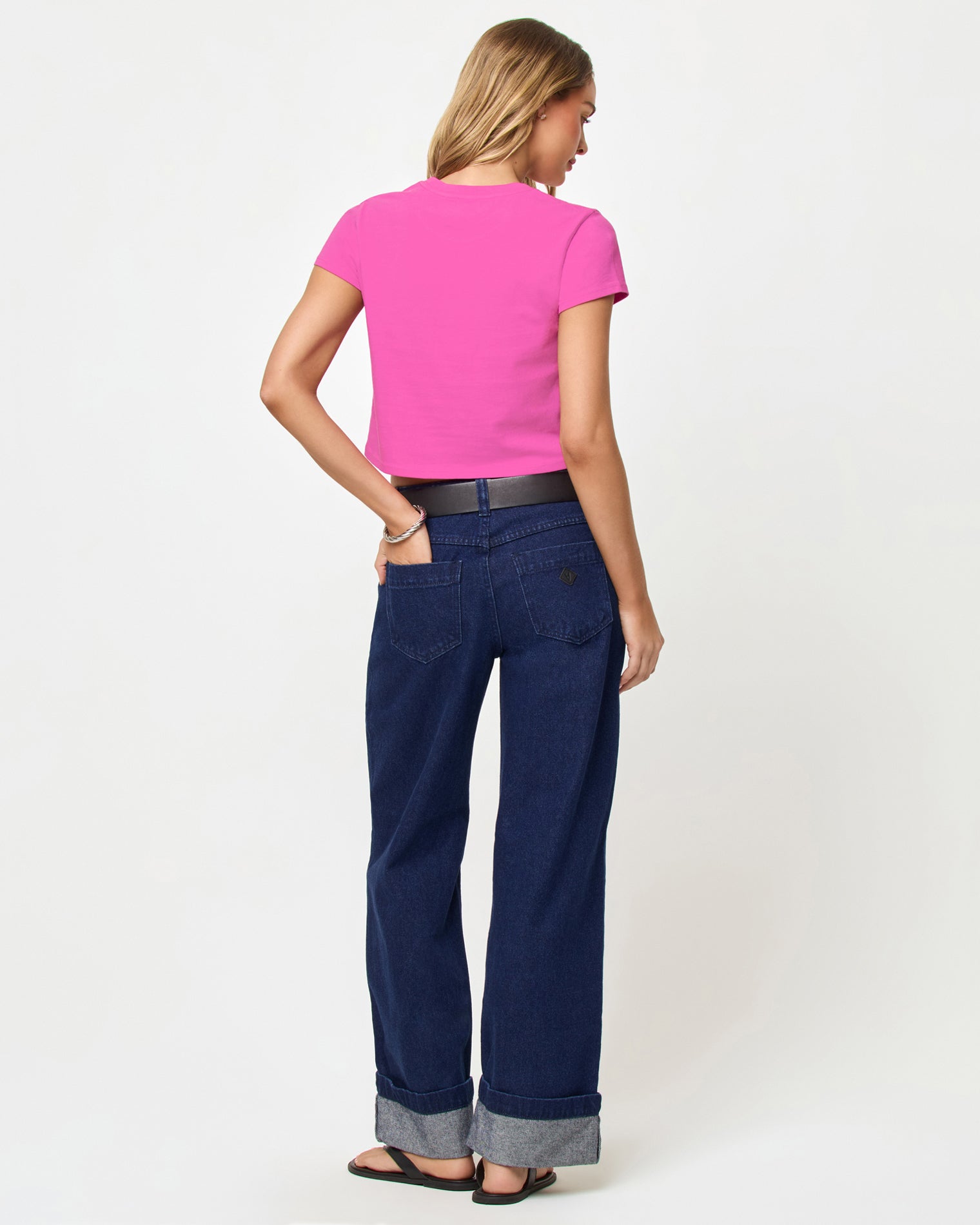 Back view of model wearing the Merci Baby Tee in Sweetheart Made in California.